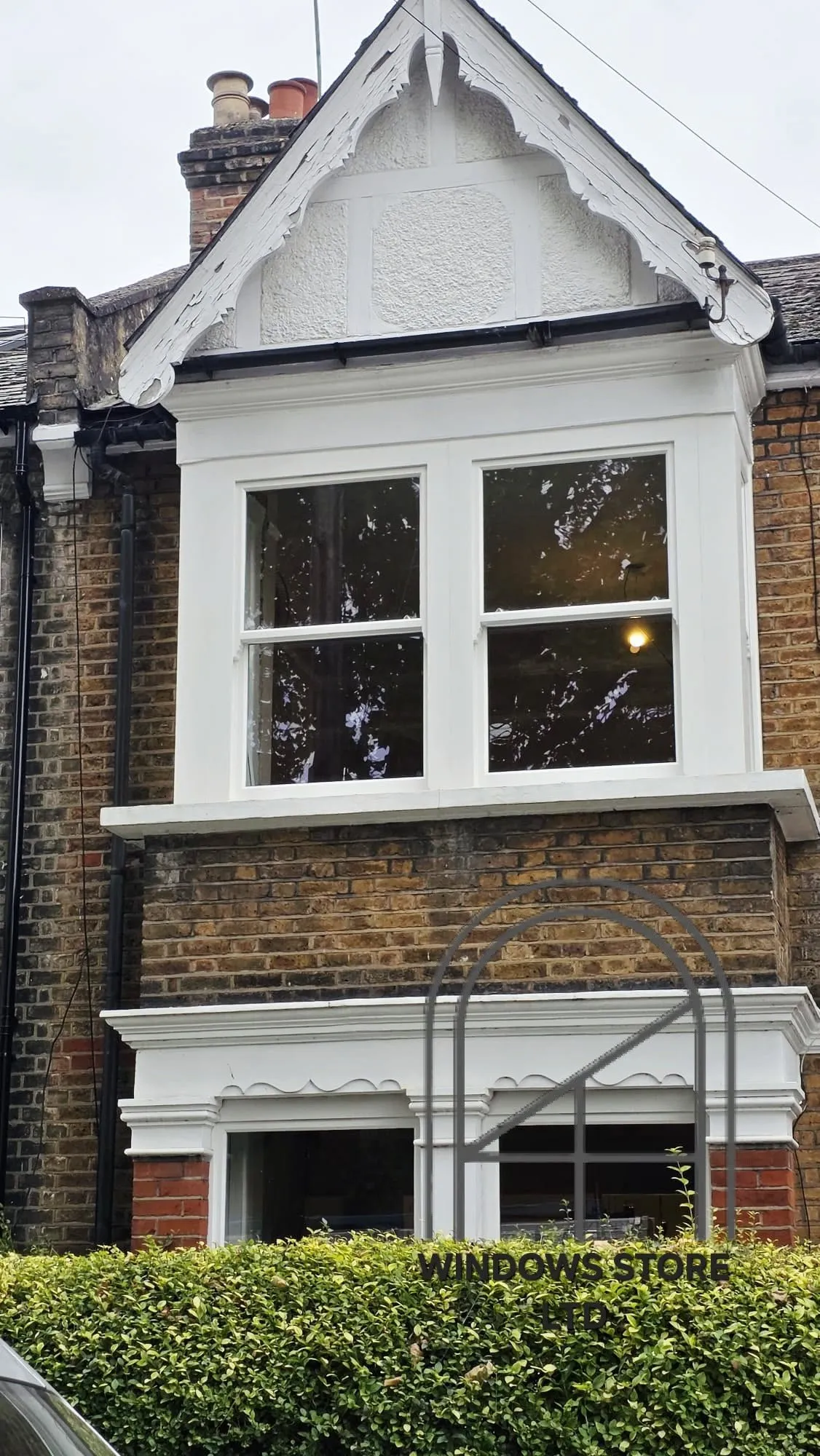 Slim-framed aluminium windows onto a garden, London