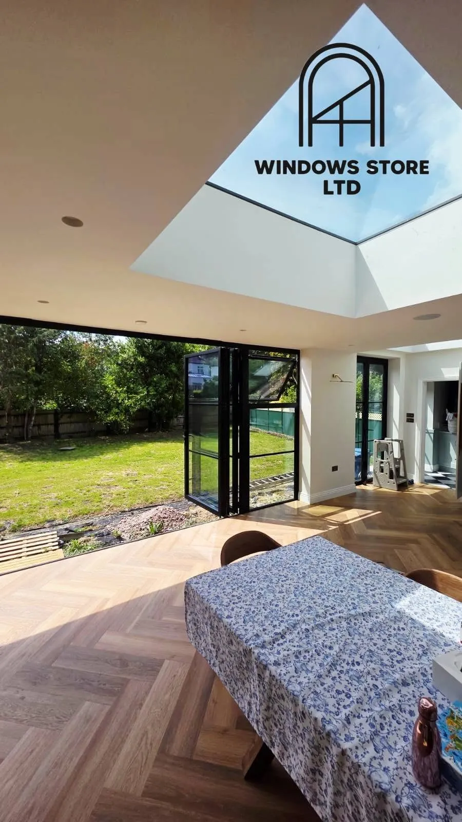 Slim-framed aluminium bifold doors in a rear extension, London