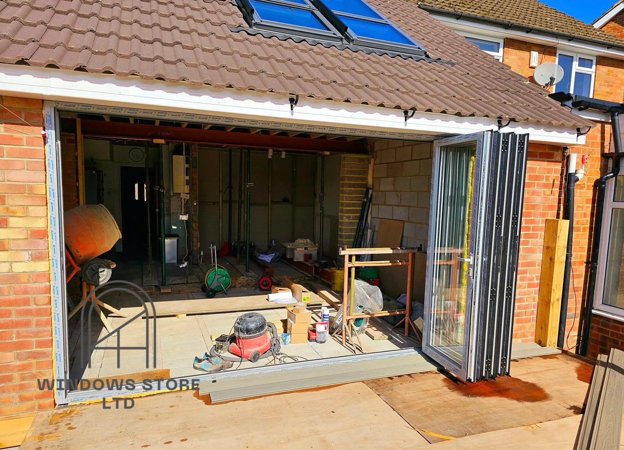 Bifold doors folded back to clear a wide opening, London