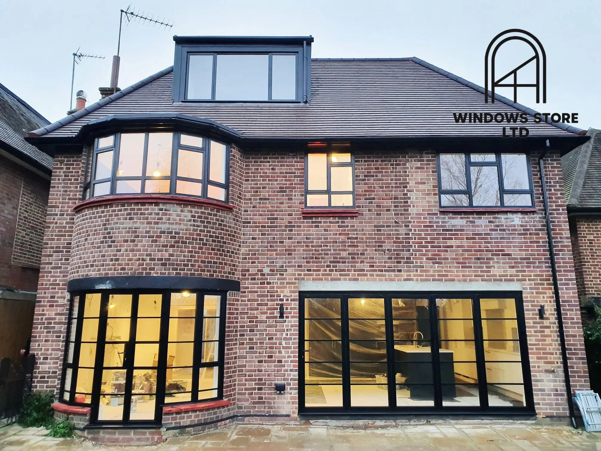 Steel-look crittall-style glazed screen dividing an interior, London