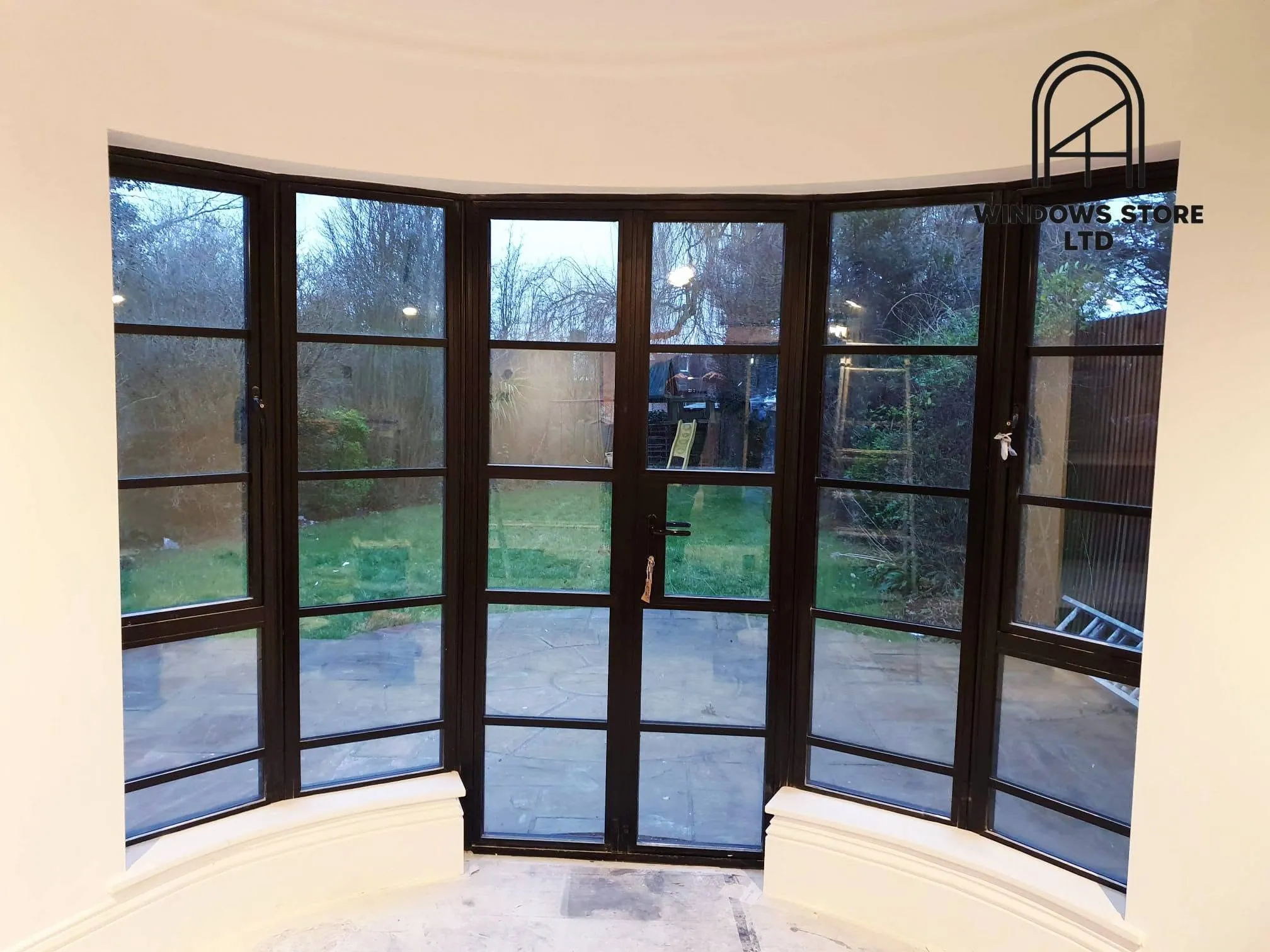 Steel-look French doors in a curved bay, London