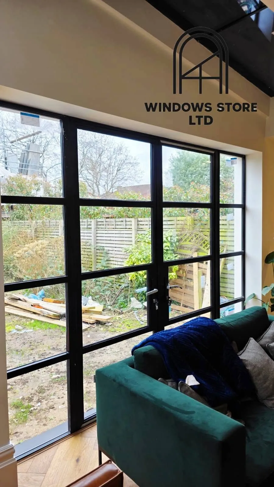 Steel-look aluminium French doors in a glazed rear wall, London