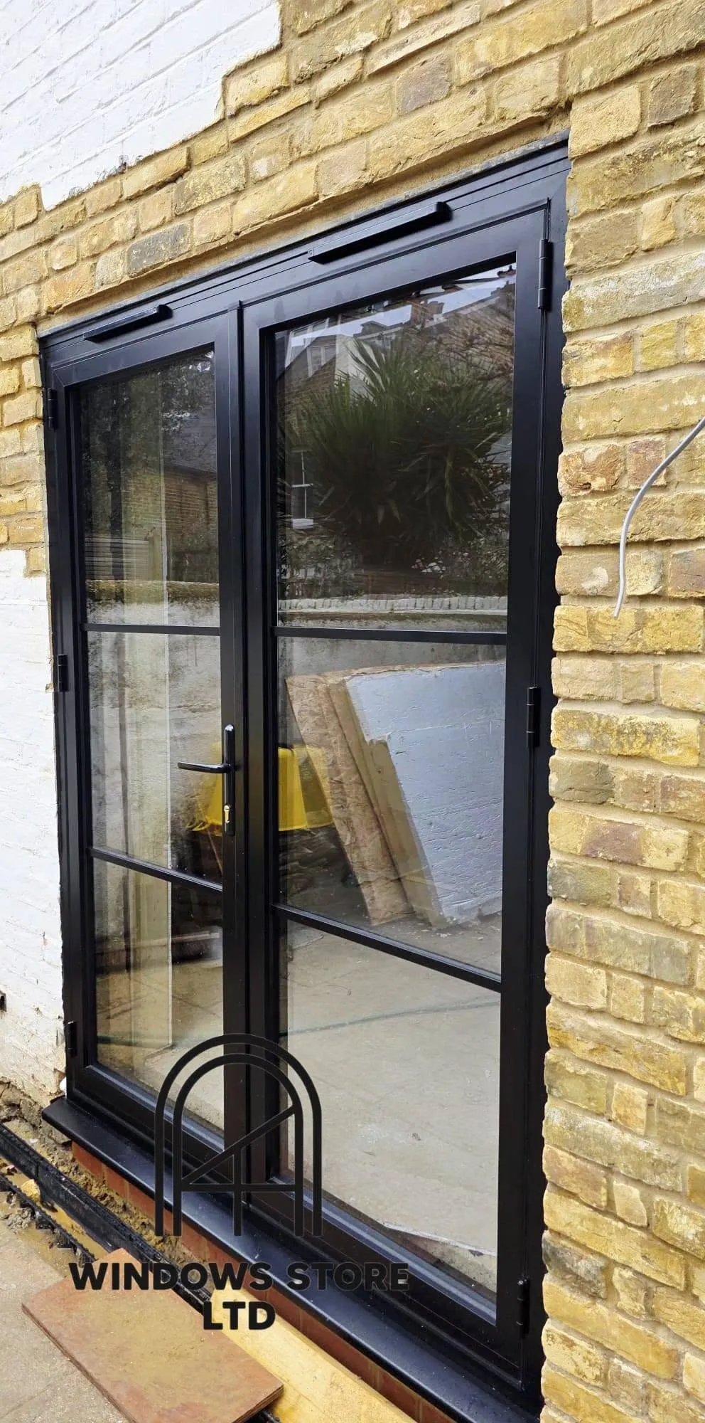 Black aluminium French doors with slim frames, London