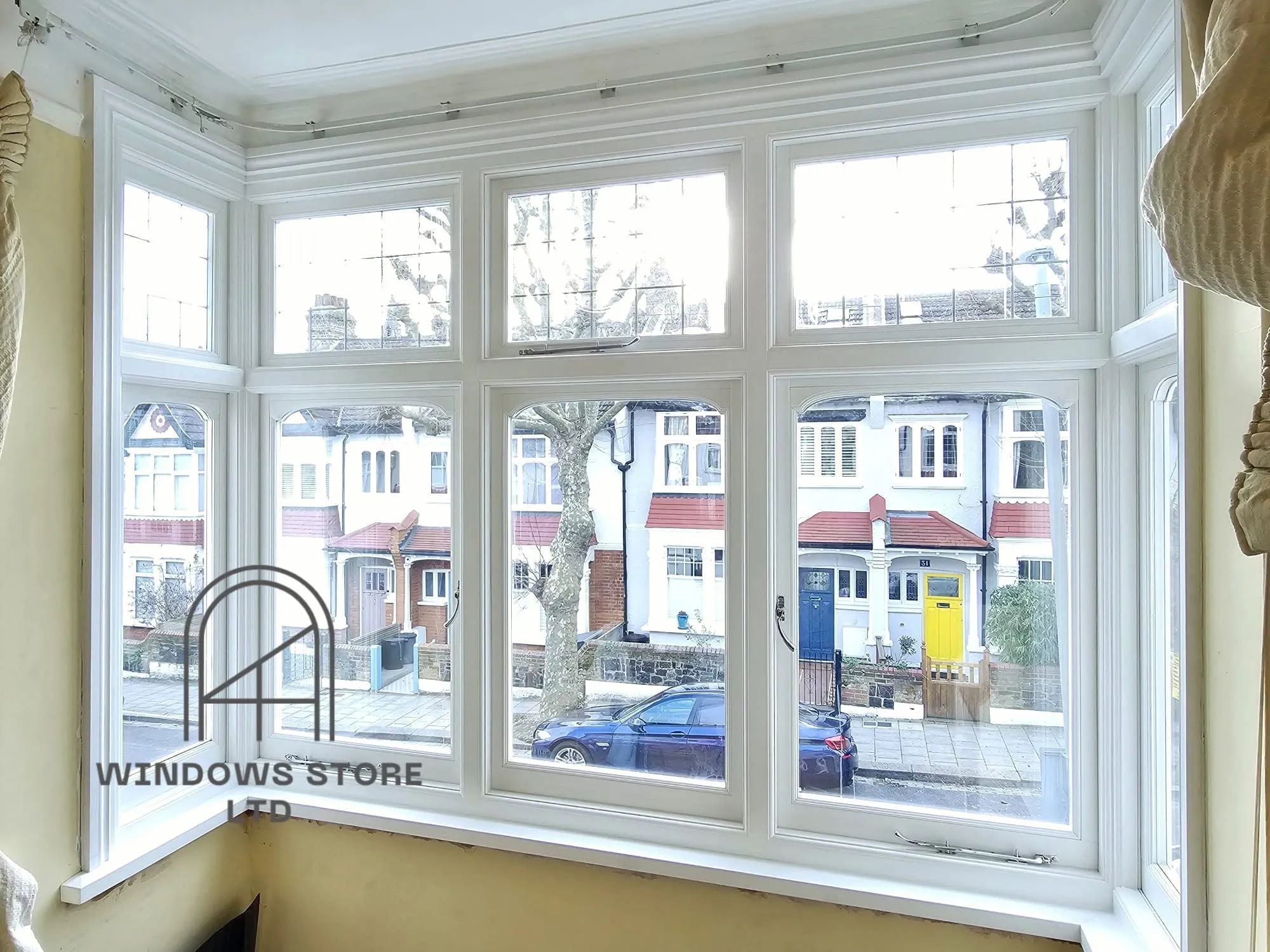 Timber casement bay window overlooking a London street