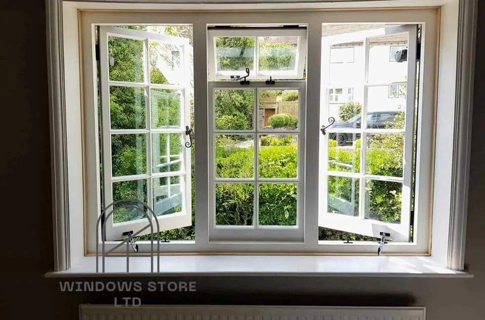 Timber casement windows opened onto a garden, London