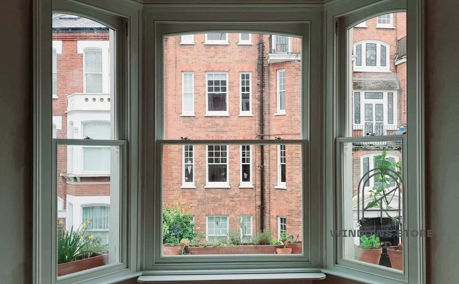 Timber sash windows in a bay overlooking a London terrace