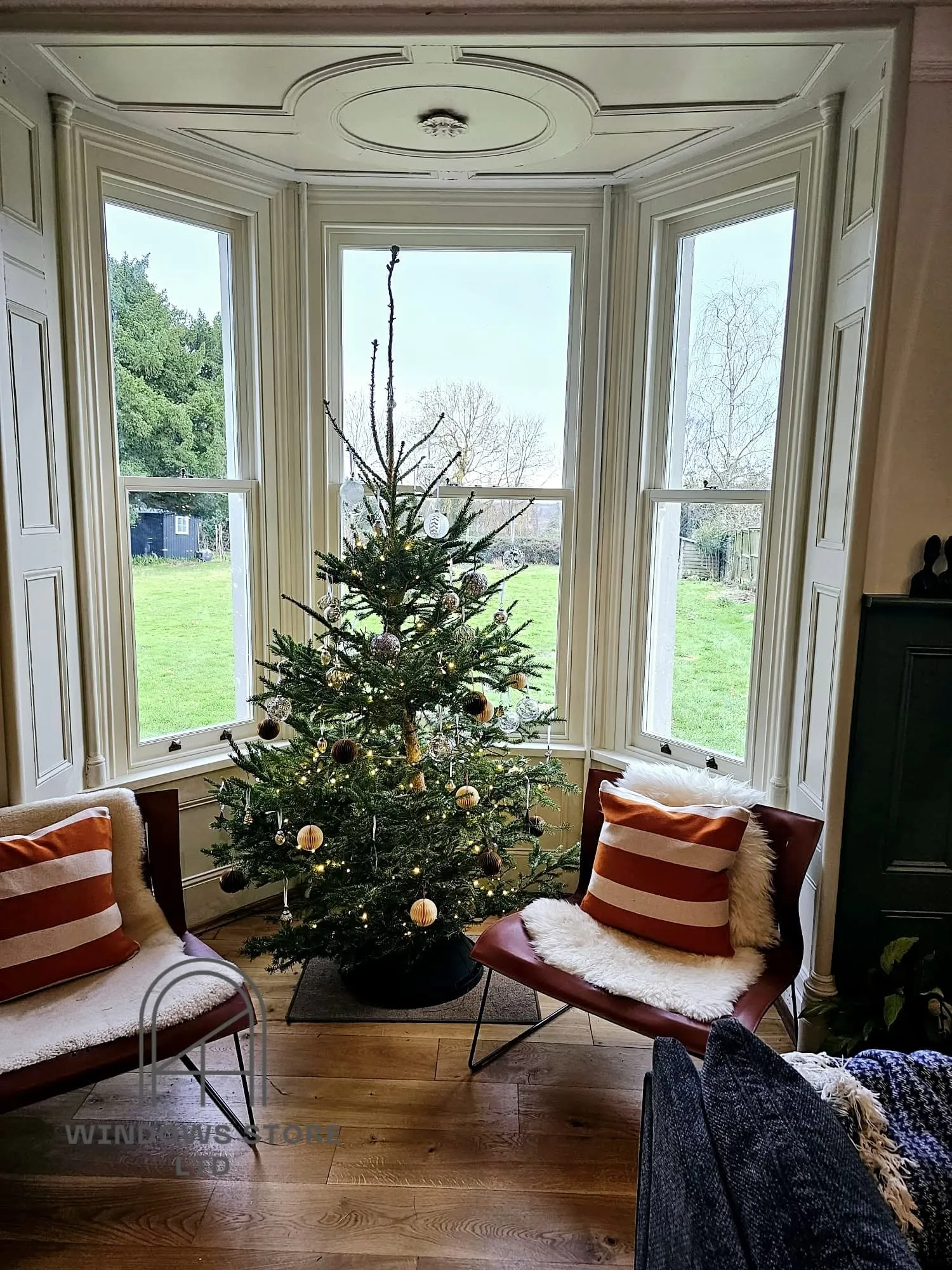 Timber sash windows in a Victorian bay window, London