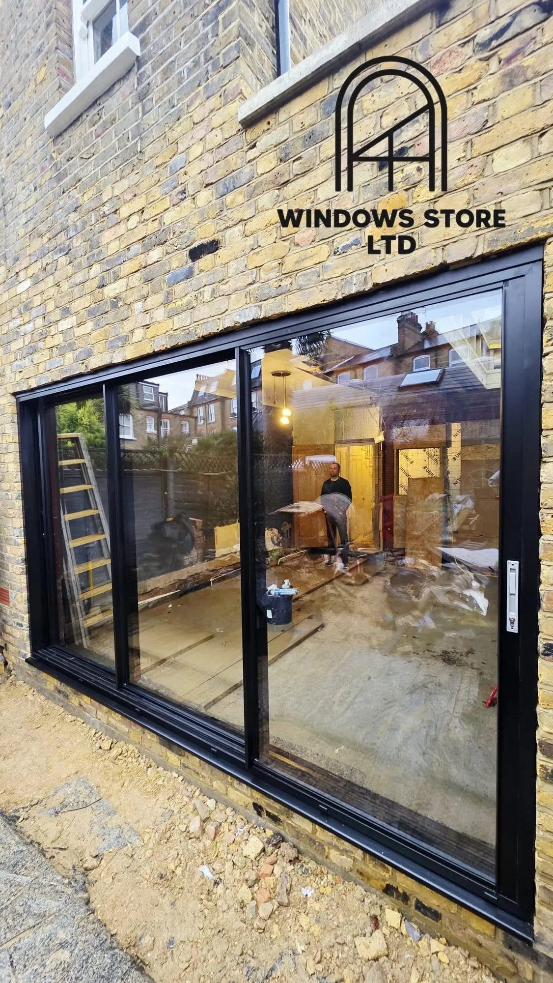 Sliding doors opening a living room onto a patio, London