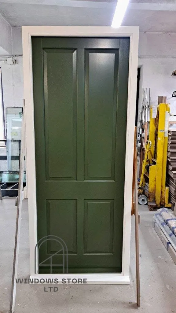 Four-panel timber front door in a painted frame