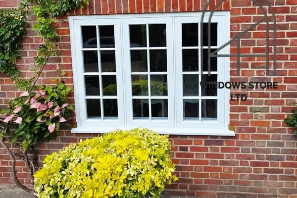 Timber casement windows with glazing bars in a London brick house