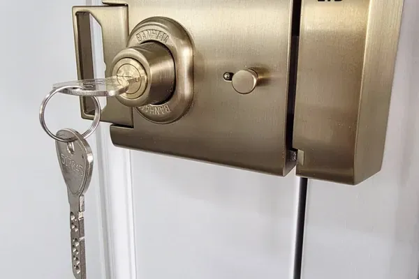 Brass Banham lock fitted to a timber window by Windows Store Ltd
